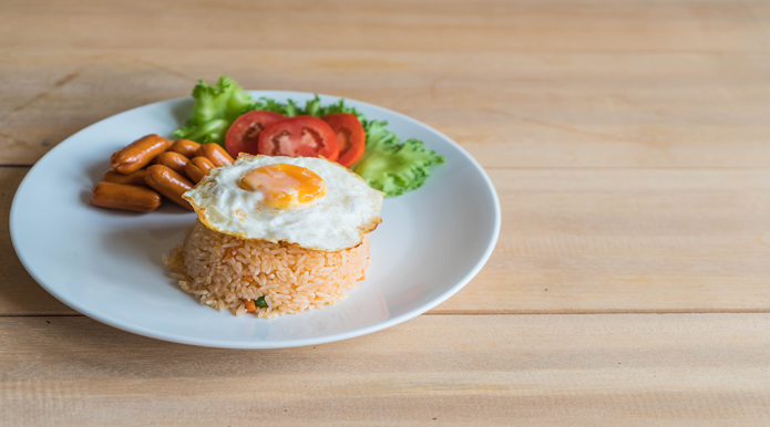 fried rice with sausage and fried egg
